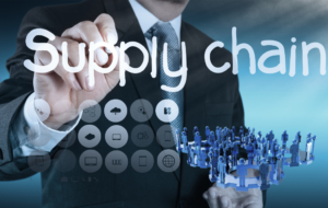 man drawing the words Supply Chain with icons scattered representing purchasing