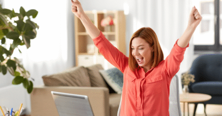 woman happy at computer